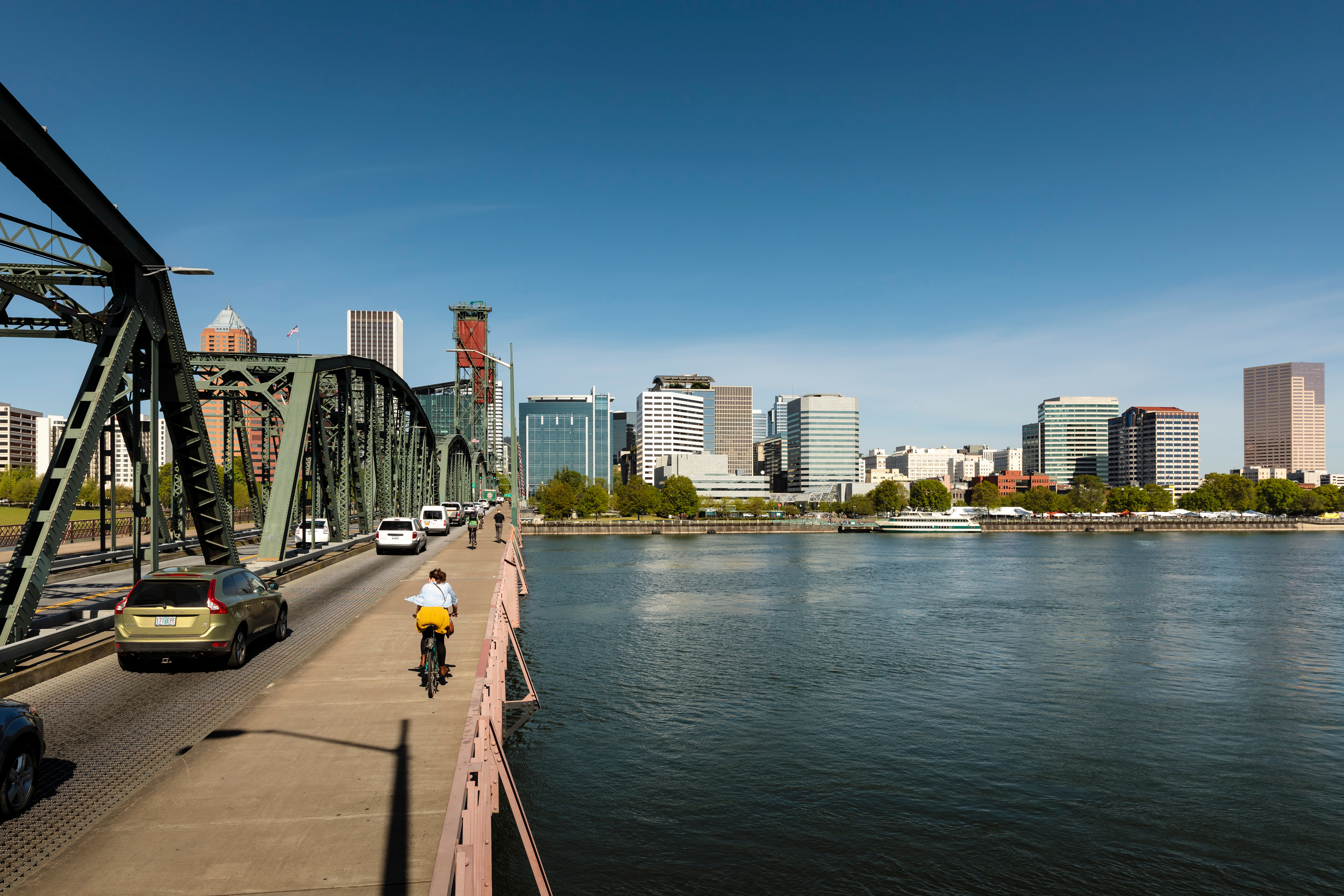 Biker on bridge toward Portland