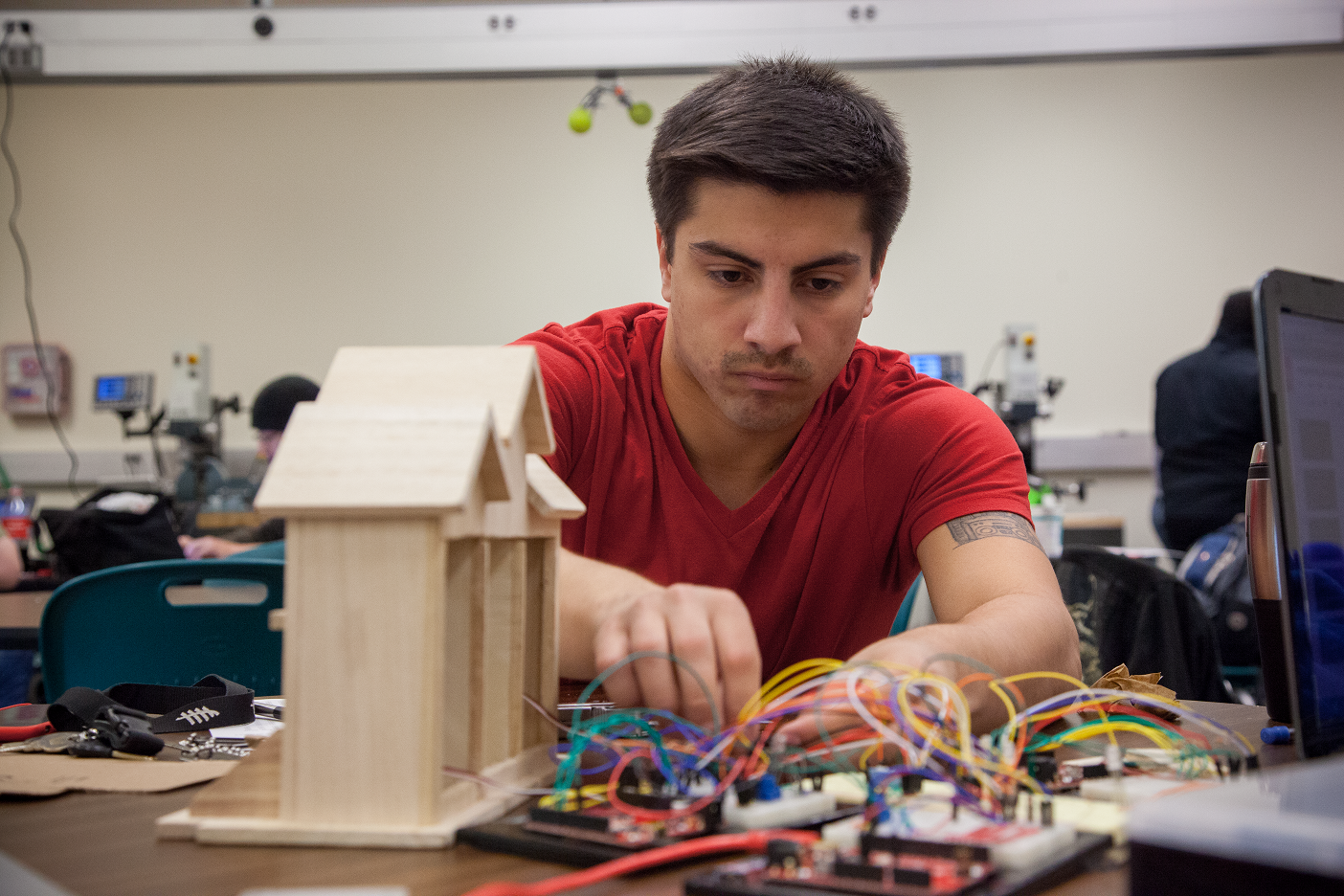 Freshman Engineering student working with arduino boards