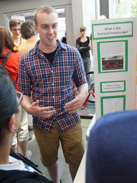 Student explaining his capstone project
