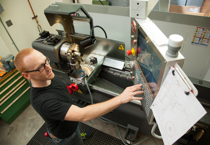 Student working on CNC mill