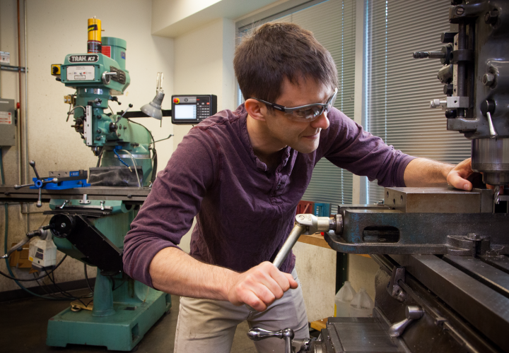 Student working in the machine shop