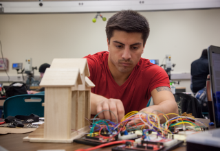 Freshman Engineering student working with arduino boards