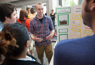 Student explaining his capstone project