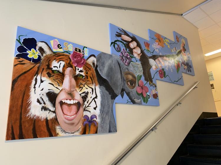 Portion of the mural featuring hybrid creatures such as a tiger, elephant and eagle with human features in a collage style, on four contiguous panels.