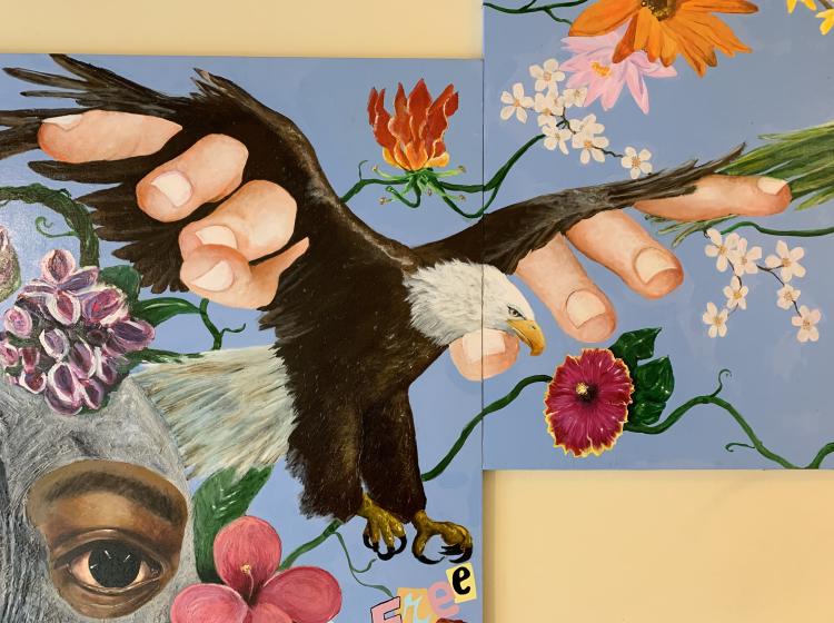 Close-up of an eagle hybrid with human fingers coming out of its wings. It's surrounded by plant life, and the word "free" appears below its feet.