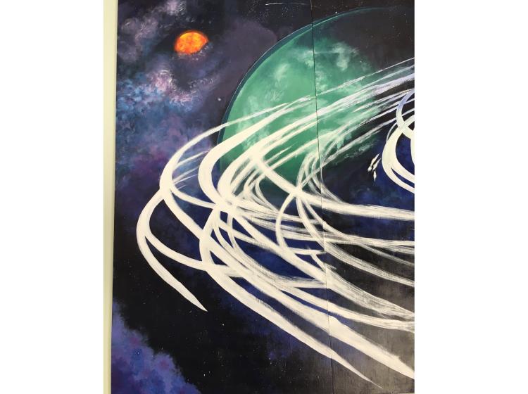 Close-up of one section of the mural. This section shows the far left end. It features space imagery suggesting planets, galaxies, and rings like those around Saturn.