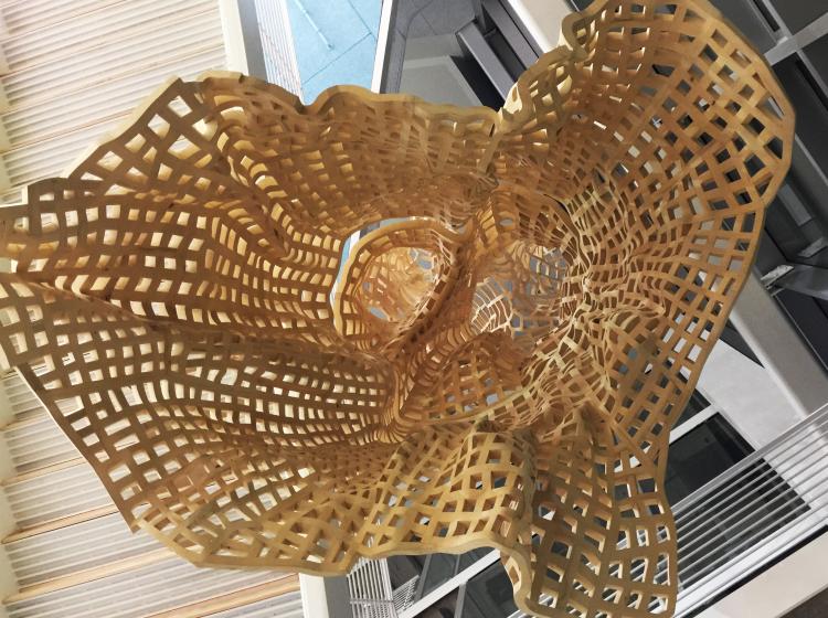 The suspended sculpture is seen from directly below.