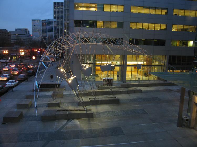 Night view of the sculpture from slightly above. Structural rods holding up the sculpture also house lighting that illuminates it.