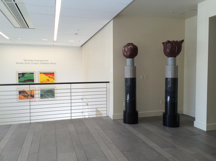 Wider shot showing the two beacons situated in the Broadway entrance of Lincoln Hall, with other artwork visible in the background.