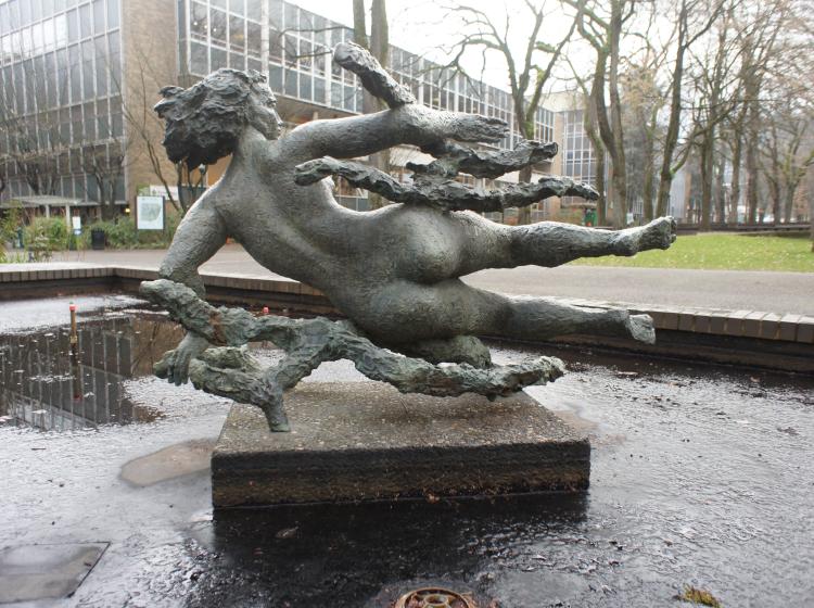 The sculpture is seen from behind.