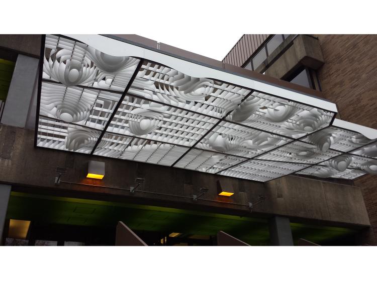 The artwork is seen from street level at a slight angle.