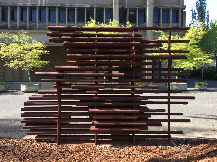 The sculpture is seen from the other side, with the "cyclist" facing to the left.