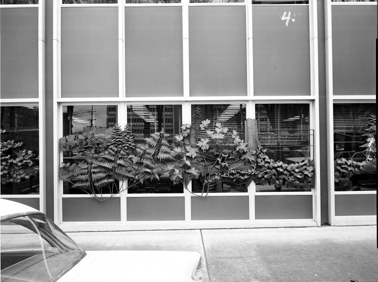 The sculpture is seen in a black and white photo from 1970, in its original location outside Neuberger Hall