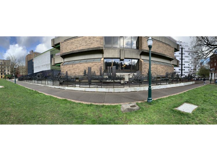 The entire sculpture is seen in a panoramic shot, along the side of the Science Research and Teaching Center