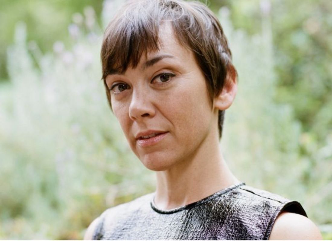 An older woman with short brown hair