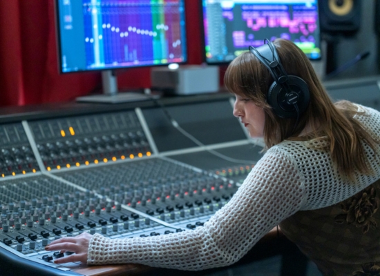 Photo of a Sonic Arts student at a soundboard.