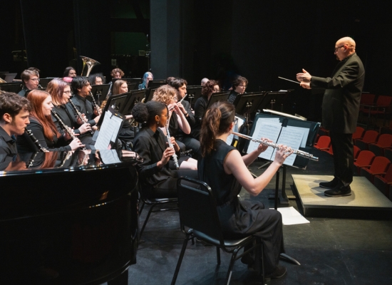PSU Wind Symphony performing on the Lincoln Performance Hall stage.
