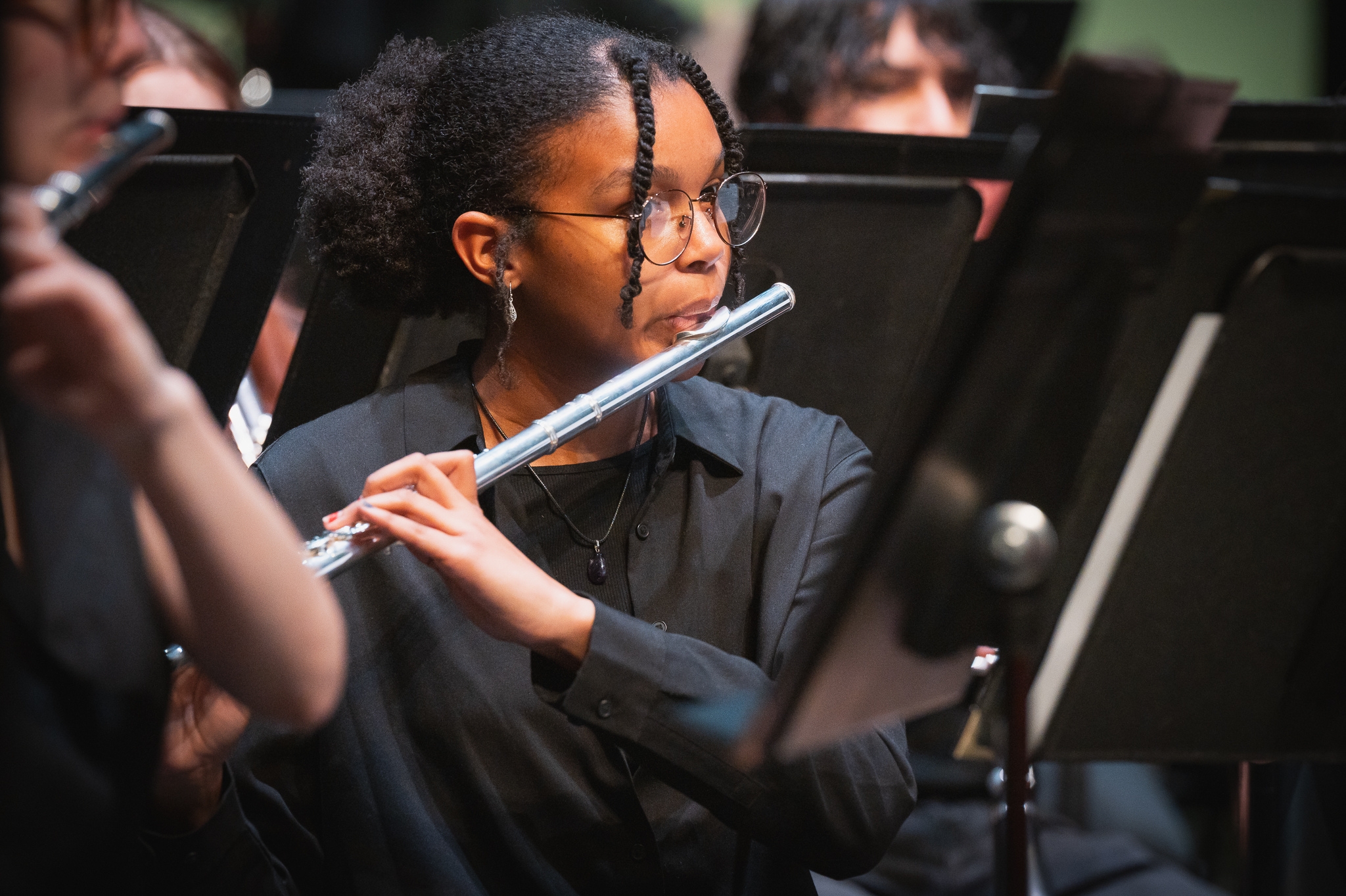 PSU student playing flute in a concert.
