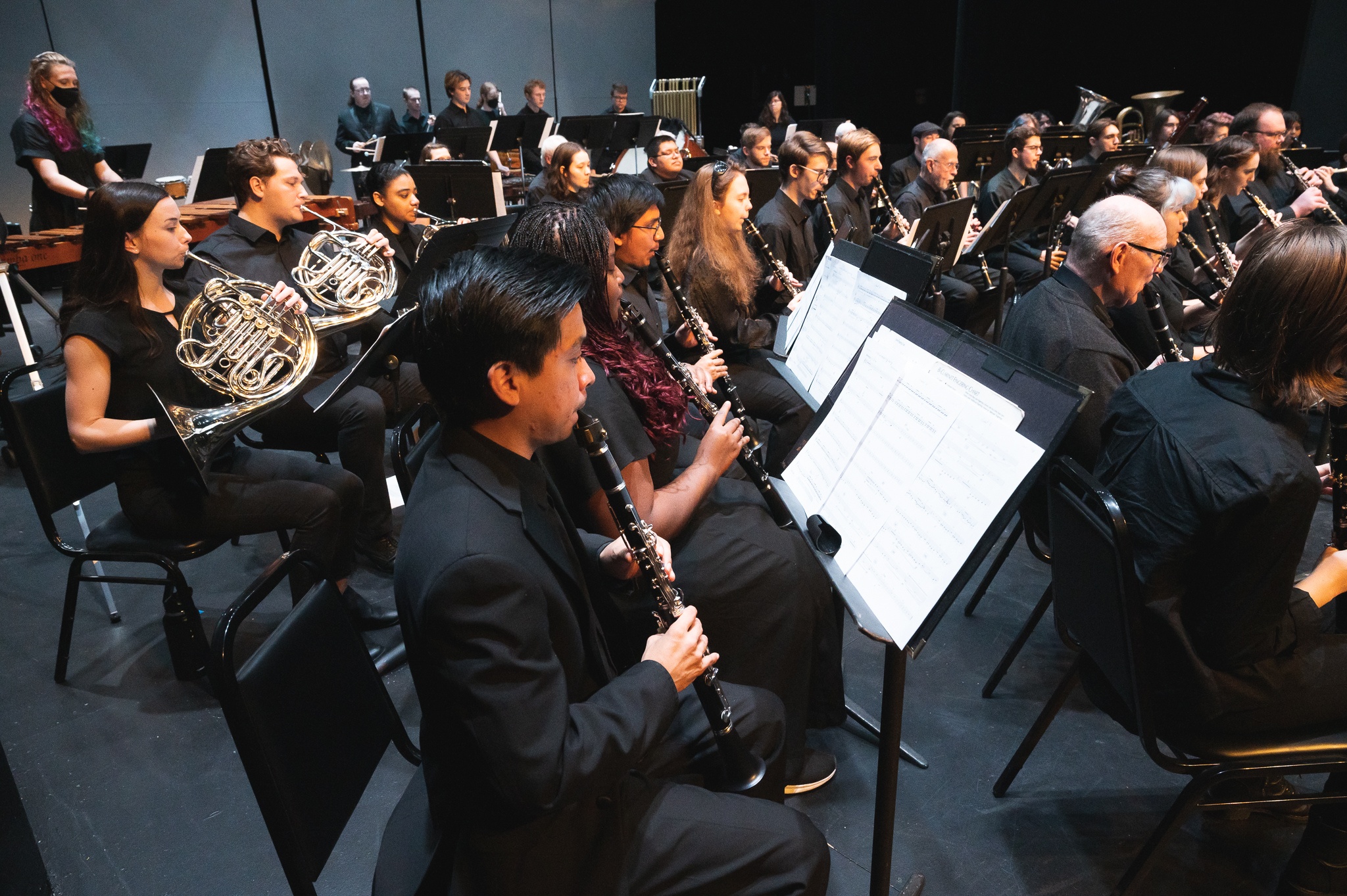 PSU Wind Symphony performing on the Lincoln Performance Hall stage.