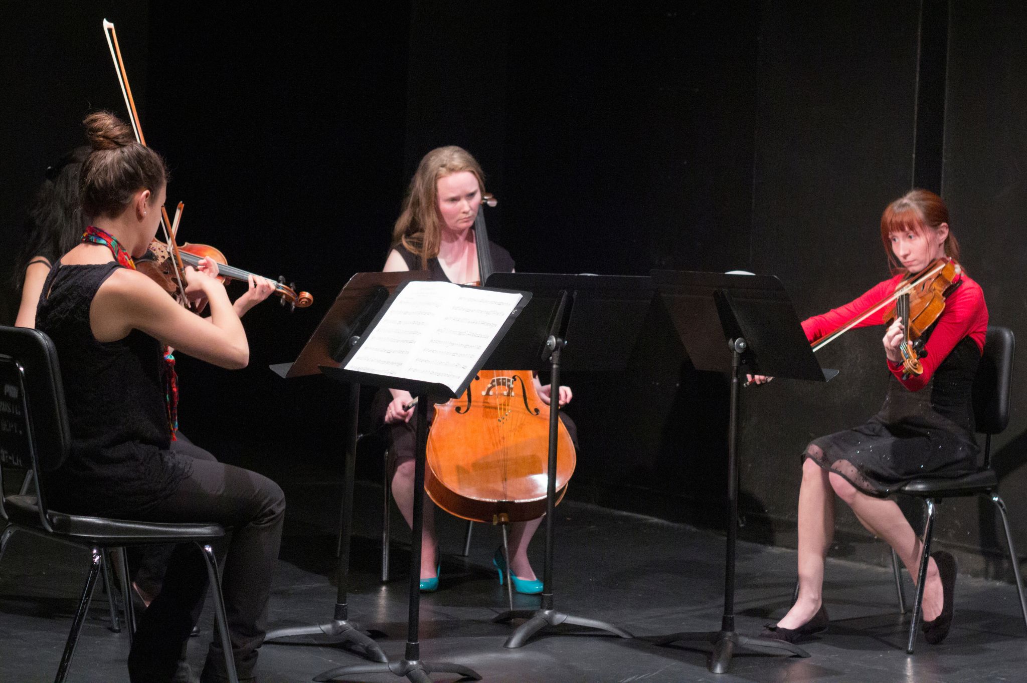 A quartet playing violins and cello.