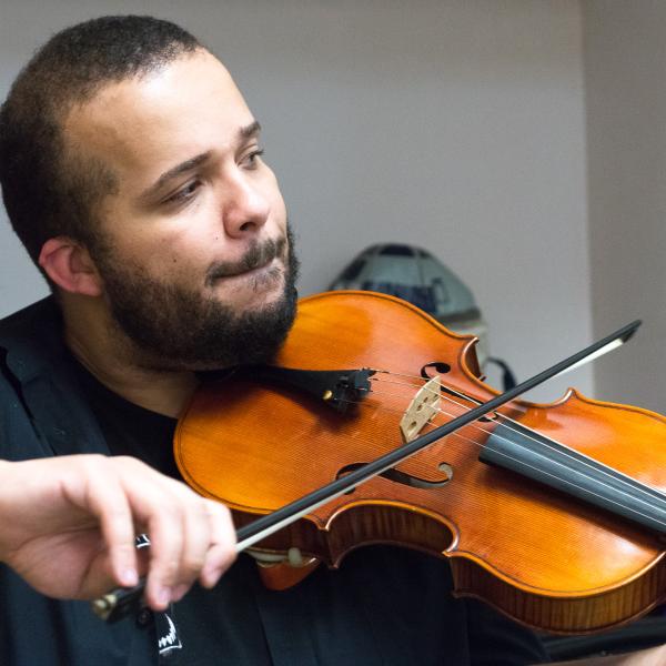Violin student performing in recital