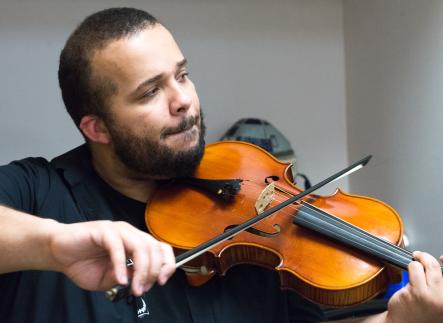Violin student performing in recital