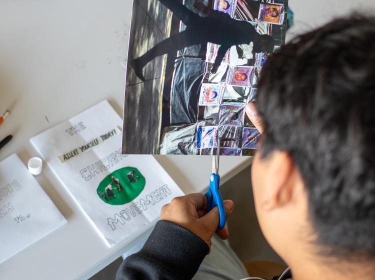 Social Justice & the Arts student creating a zine for class.