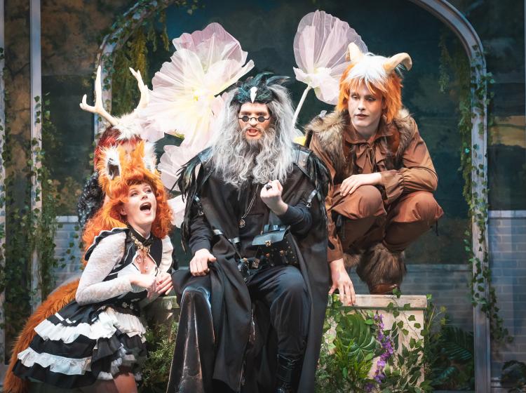 PSU Opera students performing dressed as a wizard and two half blood forest beings.