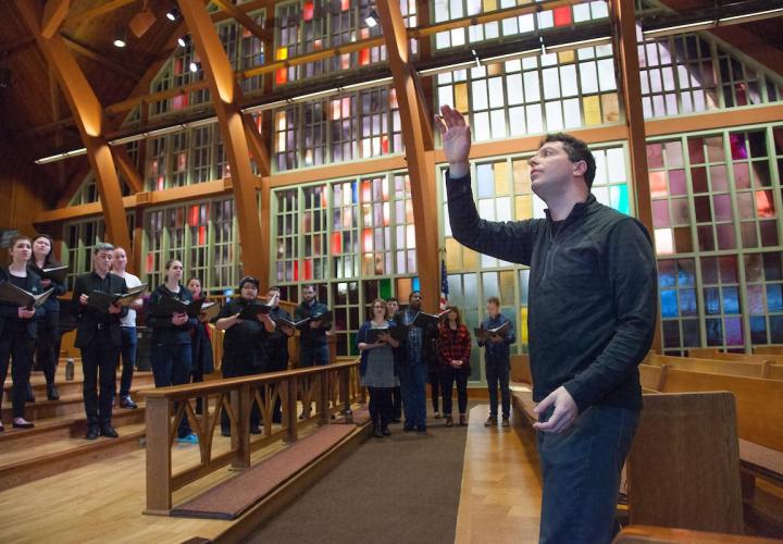 Professor Ethan Sperry conducts PSU Chamber Choir