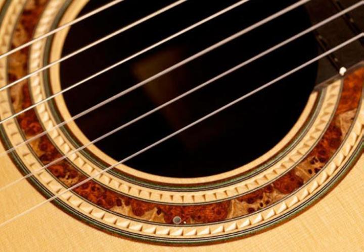 Closeup of an acoustic guitar sound hole
