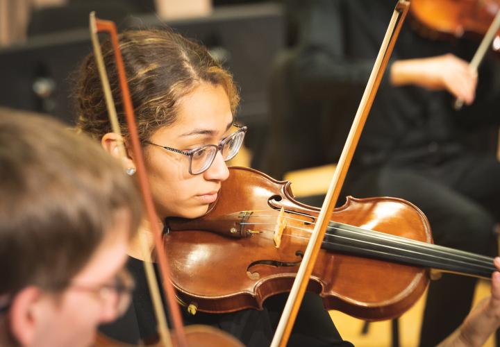 Violin student performing
