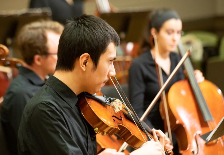 Orchestra students practicing.