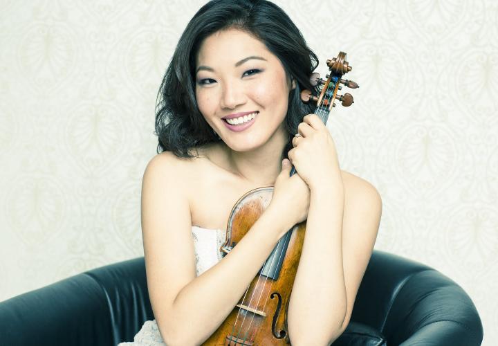 Headshot of violinist Rachel Lee Priday holding a violin.