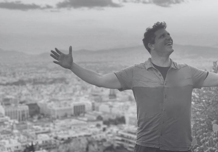 Black and white image of Choir Director Ethan Sperry.