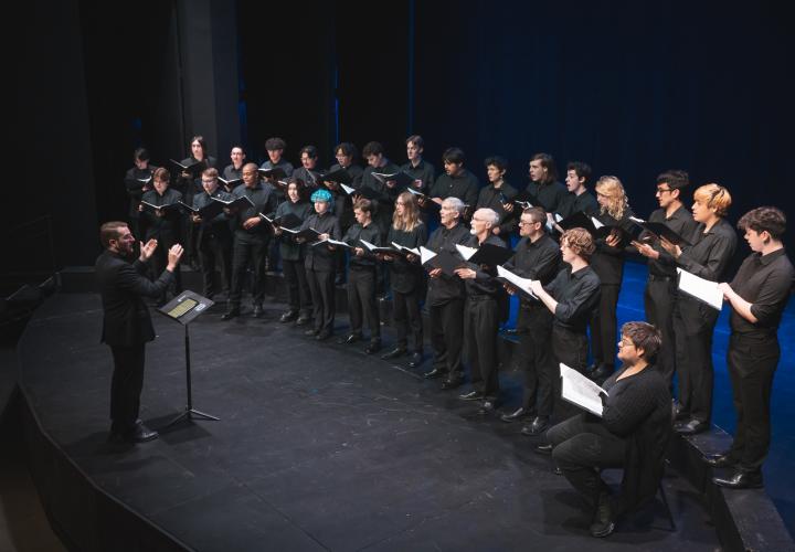 PSU Choir graduate student conducting the PSU Rose Choir