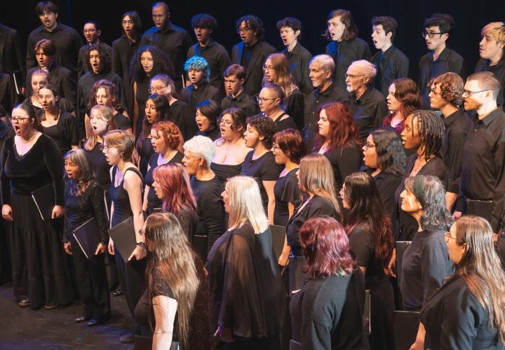 PSU Rose and Thorn Choirs, combined as the Briar Choir, singing.