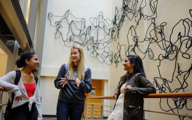 Three students talking in Lincoln Hall