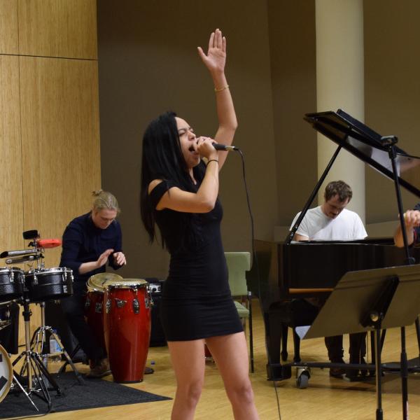 Jazz voice student performing with the salsa band