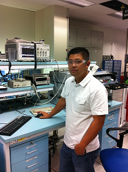 Thuy Tran in front of analytical equipment
