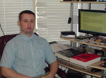 Jaden Smytherman at a computer desk with books