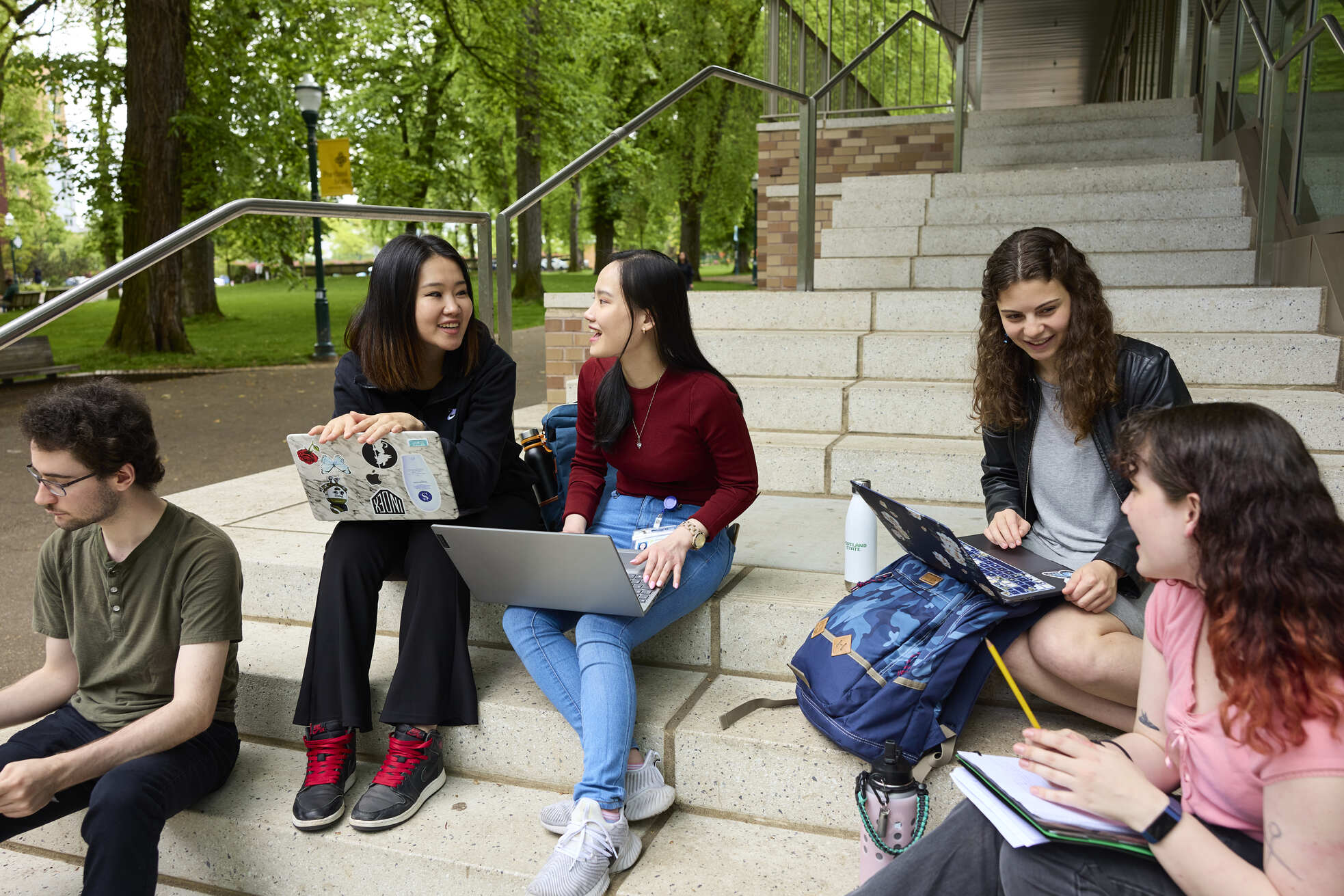 Students at Peter W. Stott Center outside staris.