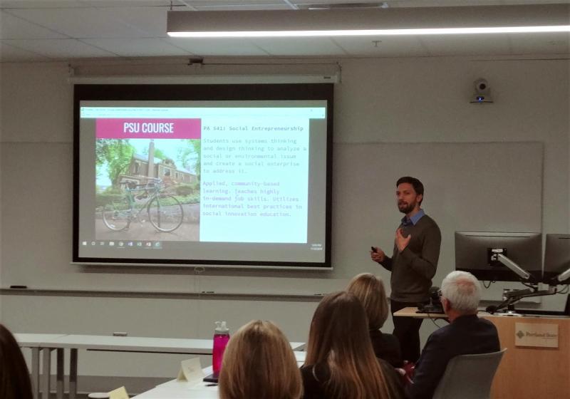 Faculty member Jacen Greene presenting