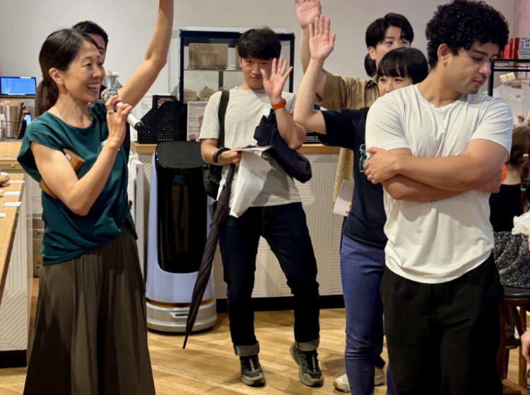 Organizer Naoko Horikawa sparks some fun crowd interaction during her welcoming remarks.