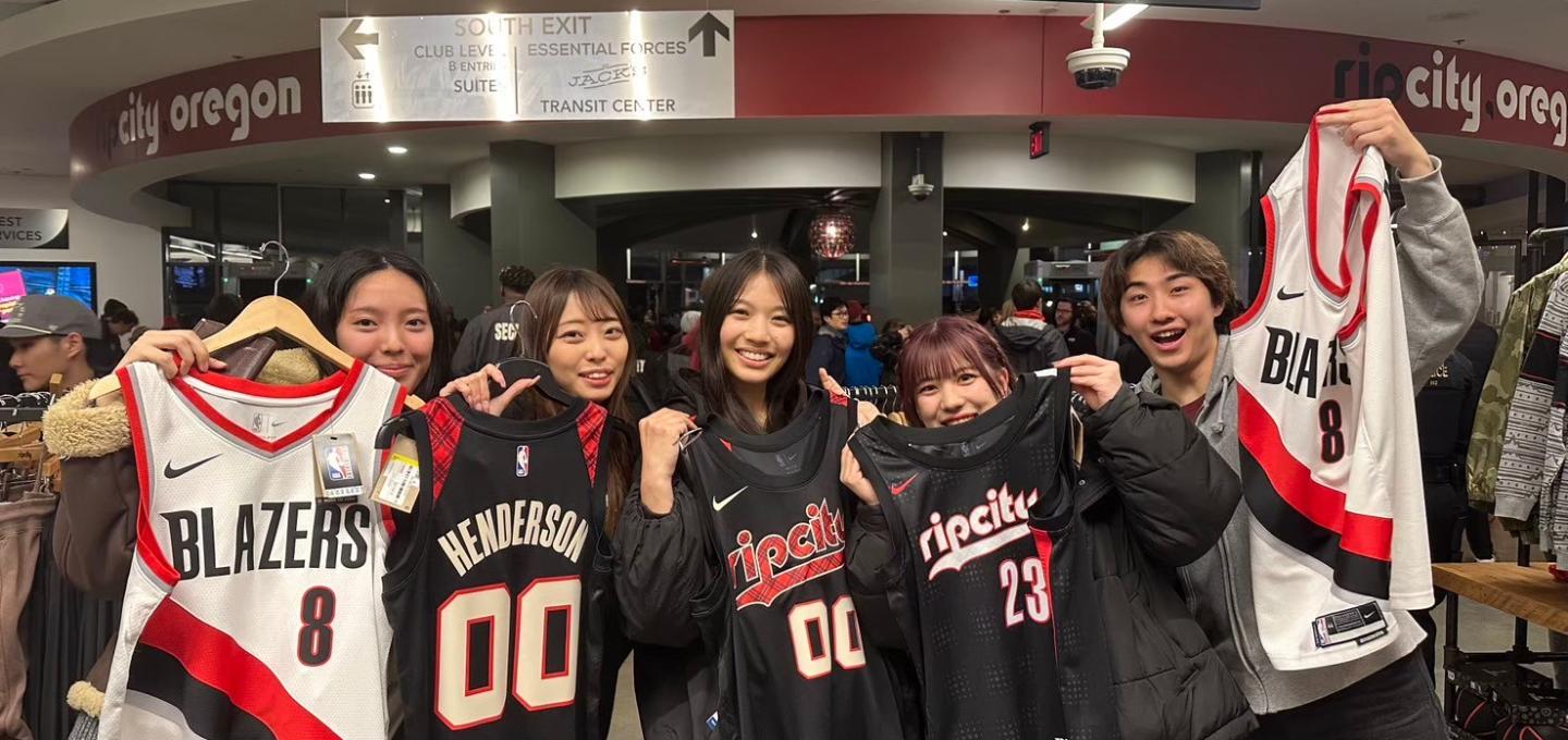 Students showing off Portland Trailblazers basketball jerseys