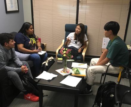 Students talking with a conversation partner.