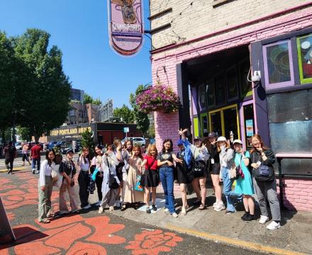 Students outside of Voodoo Donuts