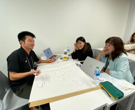 Teachers working on class project