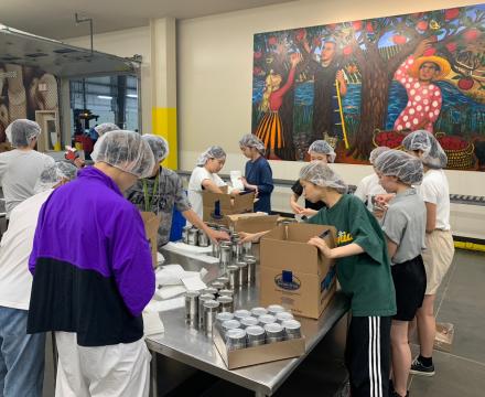 Students helping volunteer at the Oregon Food Bank sorting food