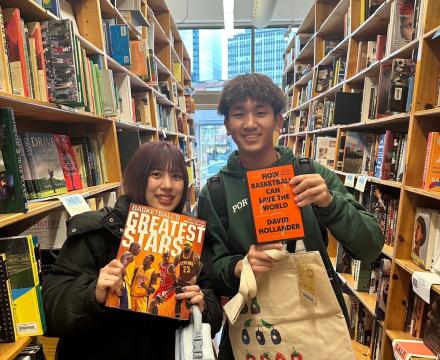 Students showing off their used books at Powell's Bookstore