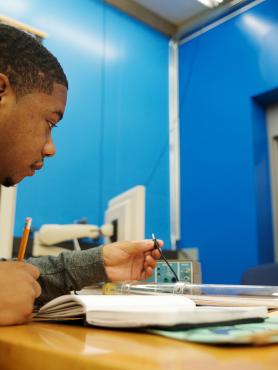 Student in lab with notebook